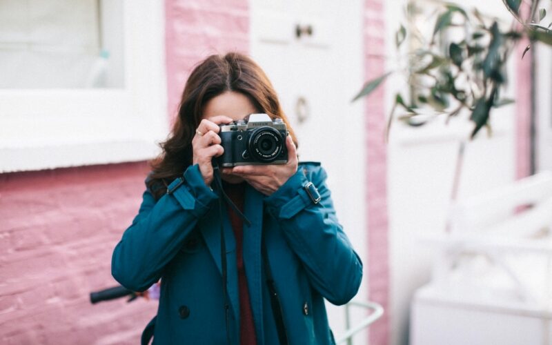 woman holding professional camera